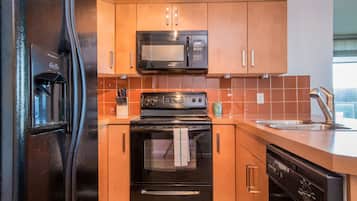 Suite, 2 Bedrooms | Private kitchen | Full-size fridge, microwave, oven, stovetop