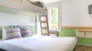 Premium bedding, desk, laptop workspace, blackout drapes