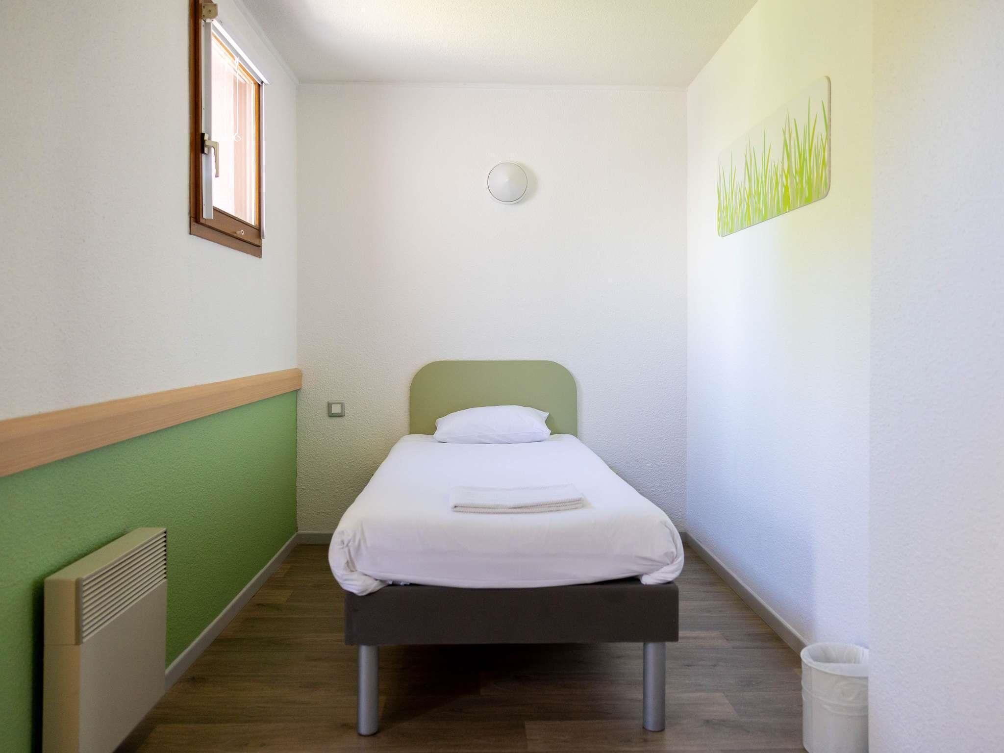 Family Room | Premium bedding, desk, laptop workspace, blackout drapes