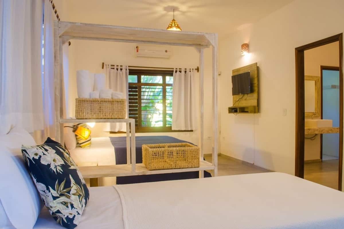 Family Triple Room | Blackout drapes, iron/ironing board, free WiFi, bed sheets