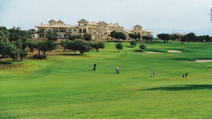A golf course with a large building in the background. - SENSATIONAL SEMI-DETACHED HOUSE TO RELEASE .... POOL OF 1.00 m2. WITH CIUCUITO SPA. (Sant Jordi, Castellón)