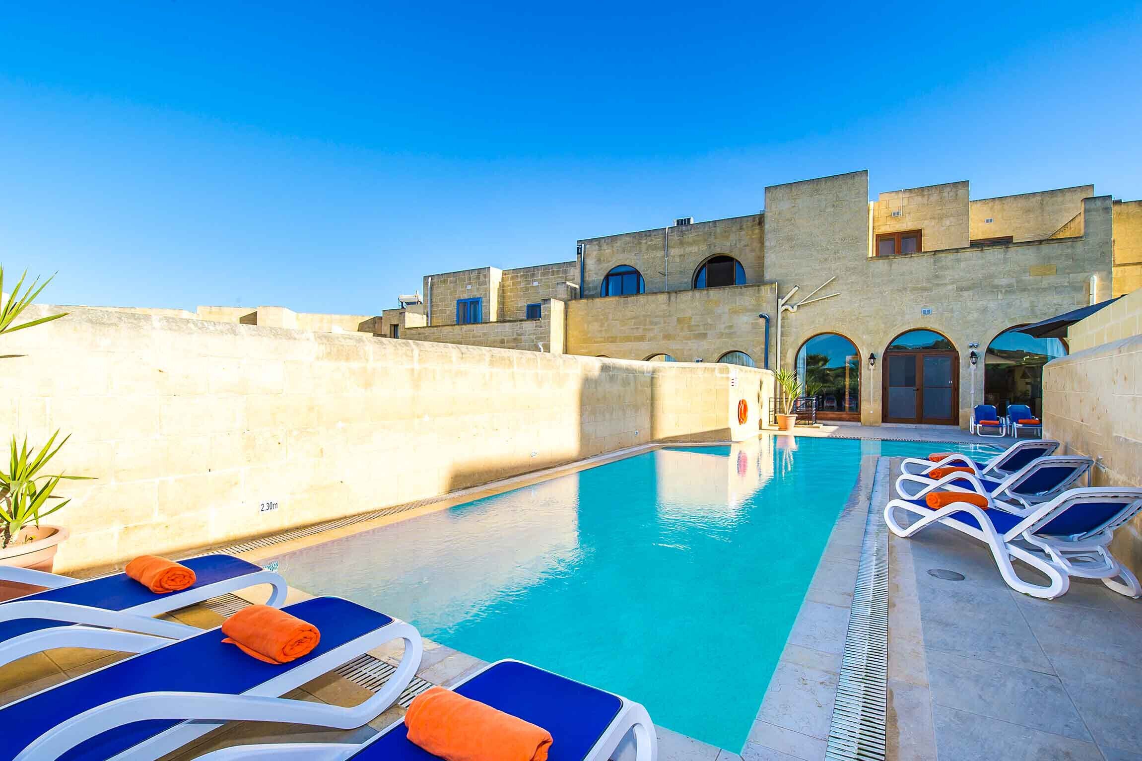 Pool area of Four Winds holiday villa in Gozo