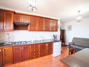 Fridge, microwave, stovetop, coffee/tea maker