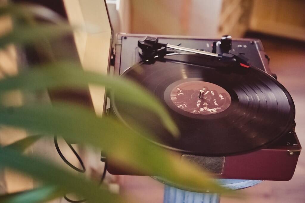 A turntable with a vinyl record.