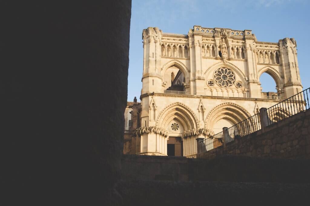A Gothic cathedral with a large rose window and two towers.