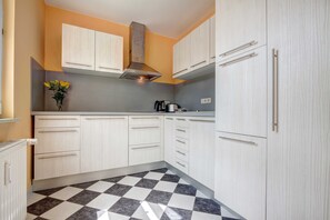 Fridge, coffee/tea maker, electric kettle, toaster