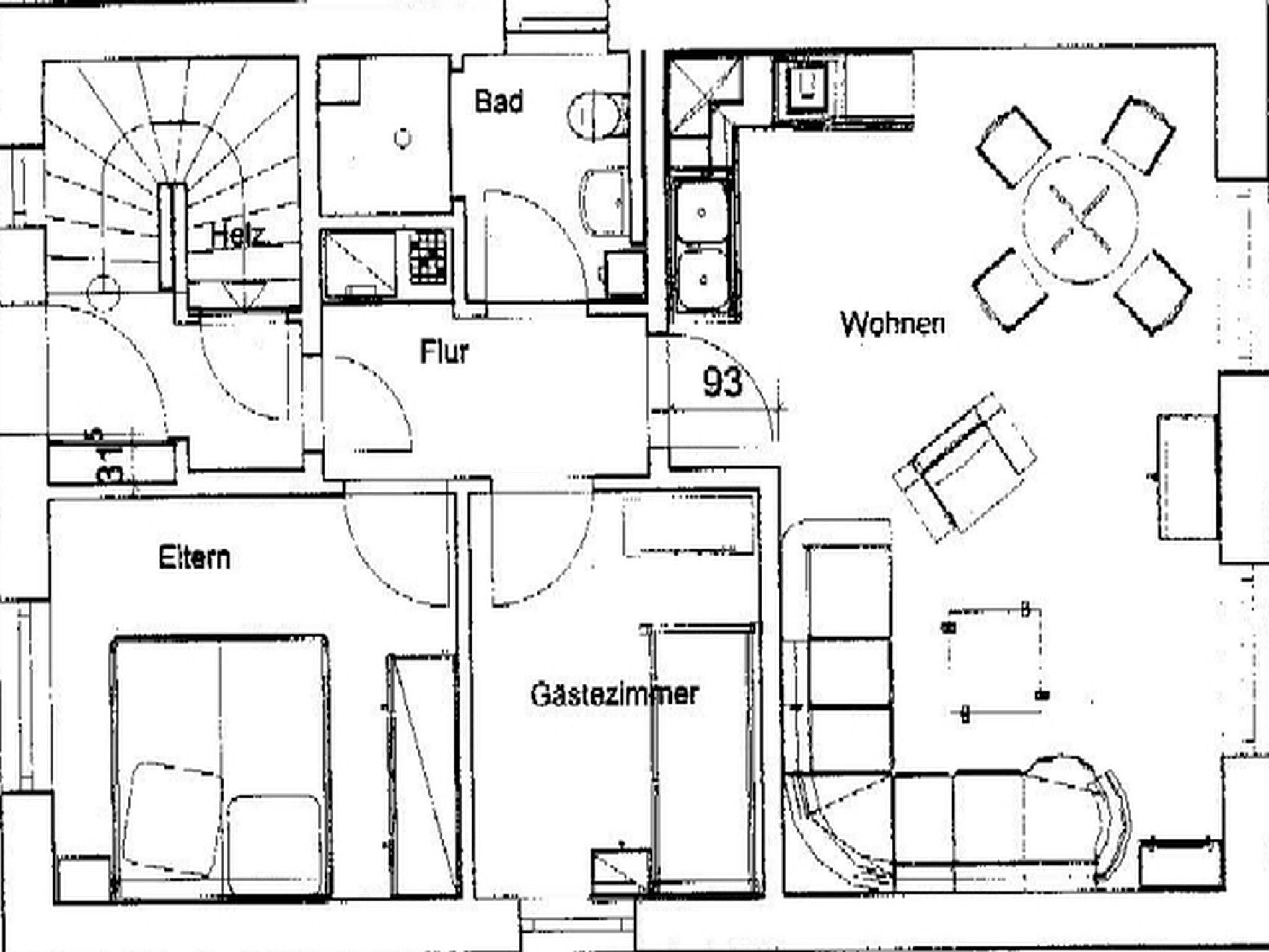 A floor plan with a dining area, kitchen, bathroom, and living spaces.
