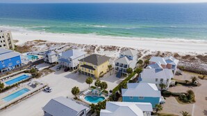 A coastal residential area with houses, a swimming pool, and a beach. - "Romar House at Beachside"Great Location-Private Heated Pool"ALVacationRentals" (Orange Beach)