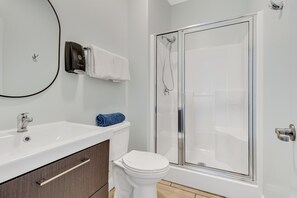 Combined shower/bathtub, towels, soap, toilet paper