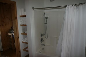 Combined shower/bathtub, hair dryer, towels, soap