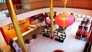 A spacious lobby with a high ceiling, a central red lantern, and multiple seating areas. - The Natural Yurt Resort at Khao Kho (Khao Kho)