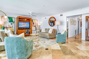 Flat-screen TV, DVD player, books
