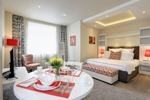 Junior Suite, 1 Queen Bed, Kitchenette, Corner | 1 bedroom, premium bedding, down comforters, pillowtop beds