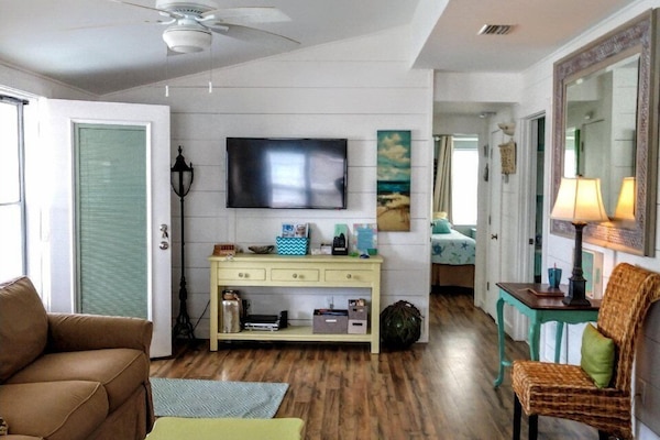 Spacious open living space with high ceiling