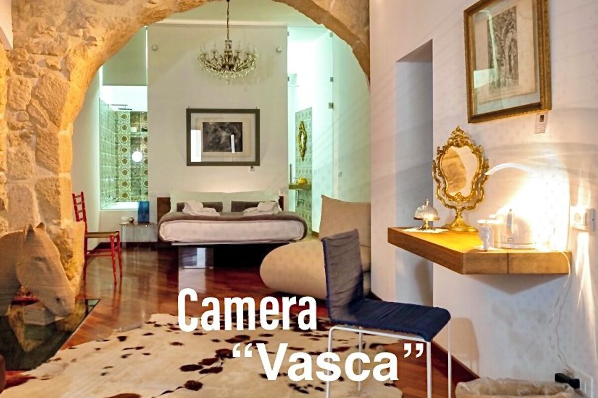Kamar Quadruple Mewah (Vasca) | Seprai premium, selimut bulu angsa, busa memori, dan minibar