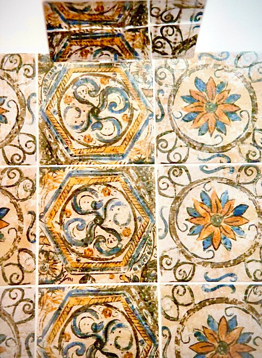 A collection of decorative tiles with intricate patterns and floral designs.