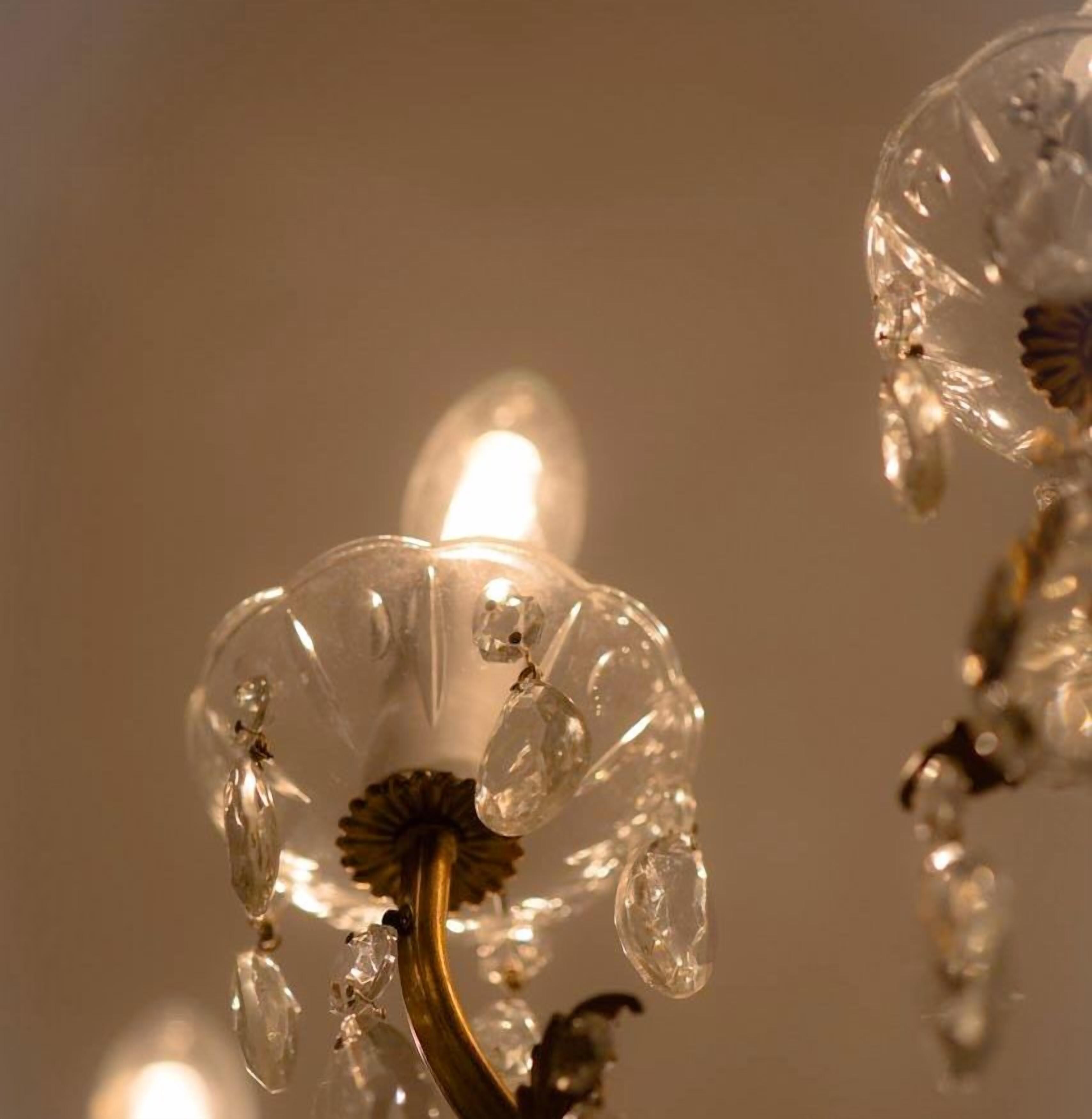 A close-up of a decorative glass structure with a warm light source.