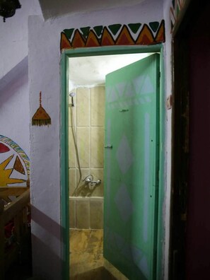 Shower, free toiletries, hair dryer, slippers