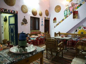 Breakfast, lunch, dinner served; local cuisine 