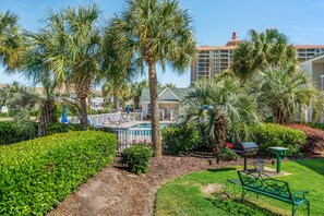 Relax by the pool amidst lush greenery and beautifully manicured gardens.