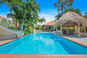 Beautiful Tropical garden surrounding a huge Pool with Heated Jacuzzi