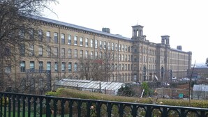 A large, historic building with multiple windows and a central tower. - Character Cottage in Haworth. Come and Enjoy Yorkshire...Yours To Discover! (Haworth)