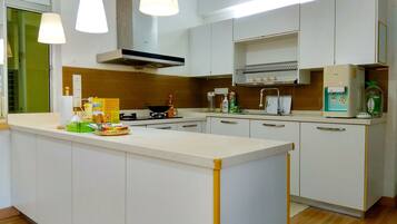 Apartment, 2 Bedrooms | Private kitchen | Fridge, microwave, stovetop, cookware/dishes/utensils