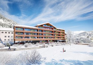 A multi-story hotel with balconies labeled with rankings from TOP 1 to TOP 21.