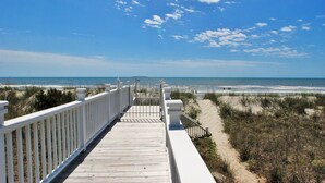 A wooden boardwalk leading to a beach with a clear sky. - OCEANFRONT / Sleeps 14 / BISHOPS / POOL / ELEVATOR / SUMMER KITCHEN (Isle of Palms)