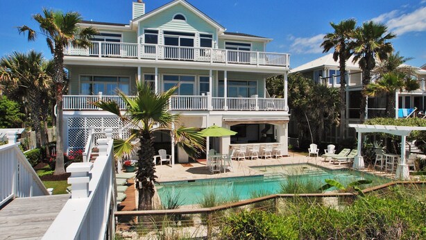 A two-story beachfront house with a swimming pool, outdoor seating, and a covered patio. - OCEANFRONT / Sleeps 14 / BISHOPS / POOL / ELEVATOR / SUMMER KITCHEN (Isle of Palms)