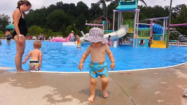 A swimming pool area with a water slide and play structures. - LOG Cabin, 5 miles from town, but very country setting (Science Hill)