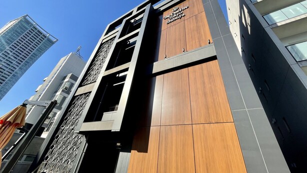 A modern building with a sign reading "The One Fly Tokyo Shibuya". - The OneFive Tokyo Shibuya (Tokyo)