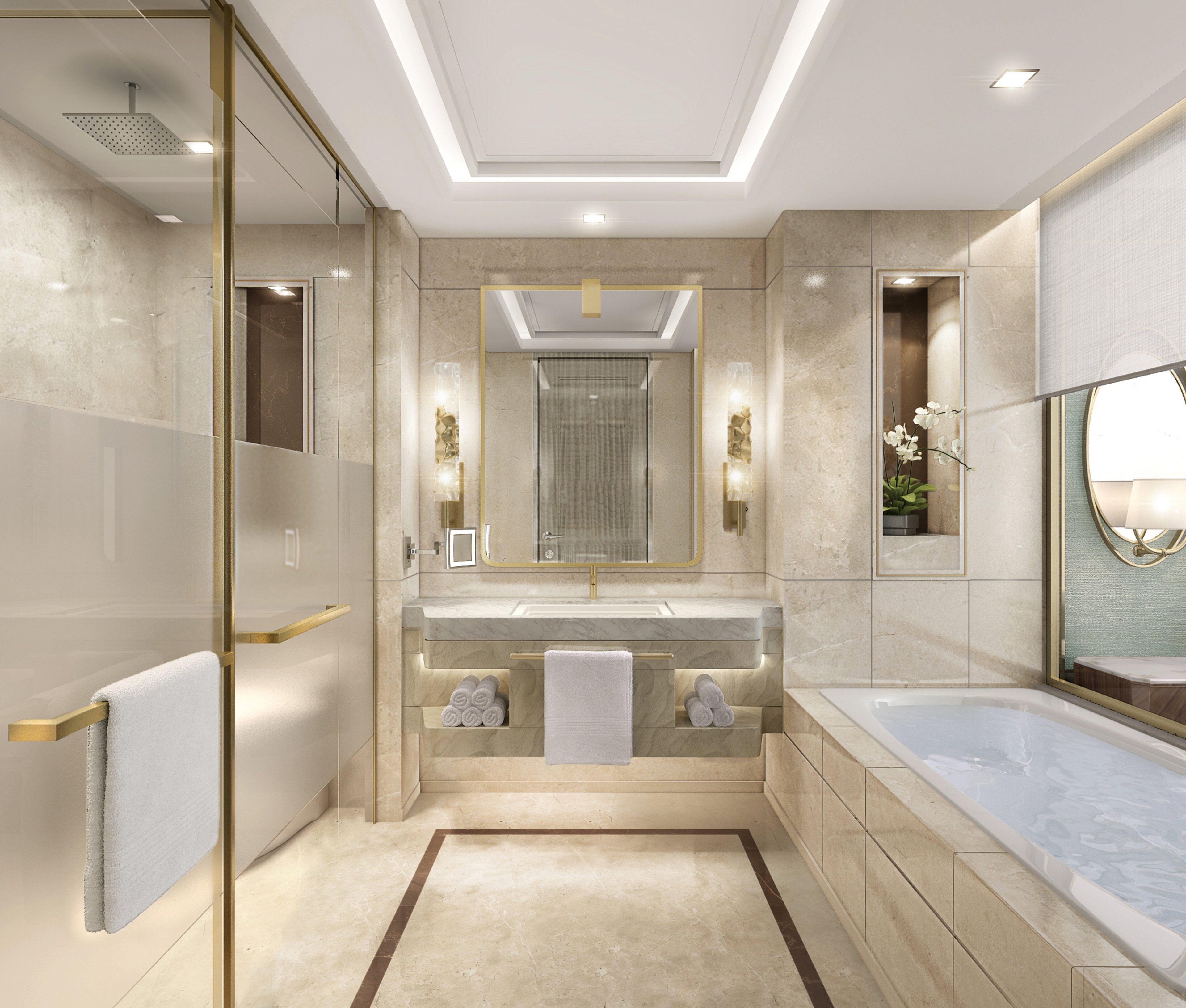 A modern bathroom with a glass-enclosed shower, a large mirror, a bathtub, and a vanity with a marble countertop.