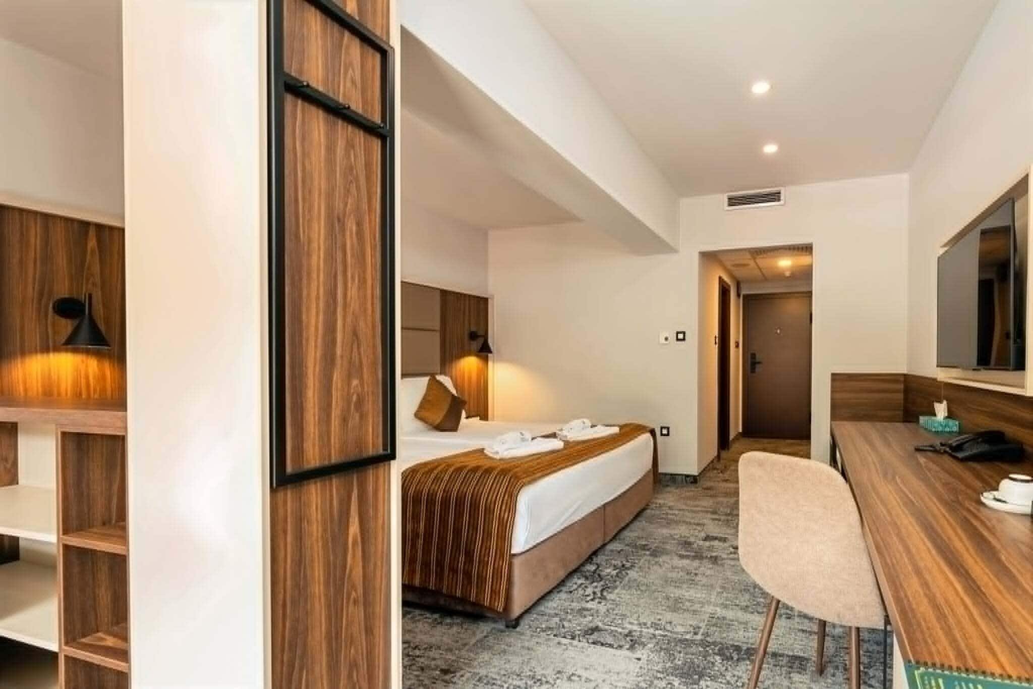 Deluxe Double Room, Pool View | Minibar, in-room safe, desk, blackout curtains