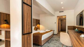 Deluxe Double Room, Pool View | Minibar, in-room safe, desk, blackout curtains