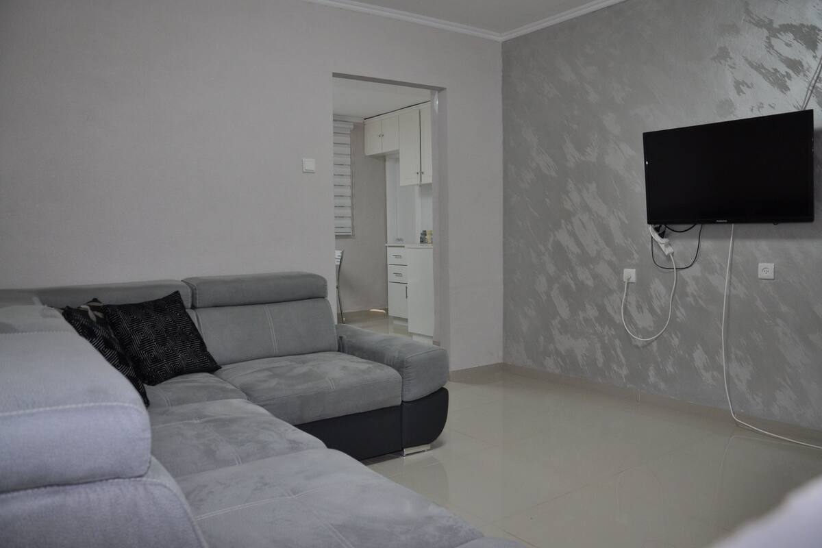 Apartment, Non Smoking, Beach View | Living room | Flat-screen TV