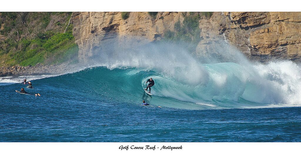 A surfer riding a wave at Golf Course Reef in Mollywood.