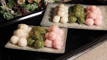 Three square plates with different colored and shaped food items.