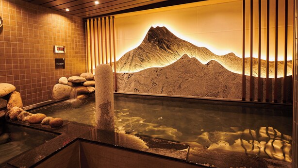 A hot spring bath with a mountain mural, wooden beams, and a clock. - Dormyinn EXPRESS SEOUL Insadong (Seoul)