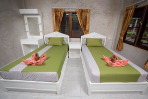 A twin room with two beds, a small table, and a mirror. - Sasi Resort (Song Phi Nong)
