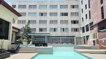 Outdoor pool, open 7:00 AM to 7:00 PM, pool loungers
