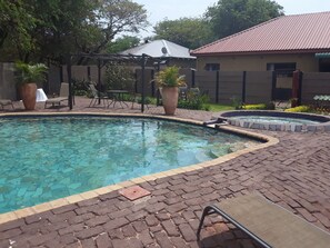 Outdoor pool, open 6:00 AM to 6:00 PM, pool umbrellas, pool loungers - Sweet Holiday Homes (Victoria Falls)