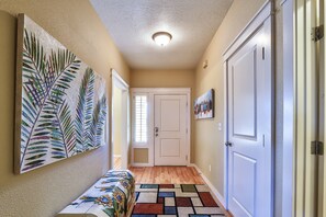 Stunning hallway with artwork and natural light-inspired decor.
