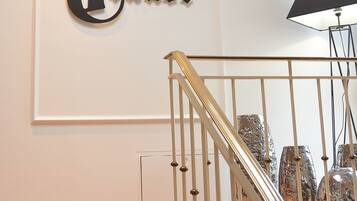 A hotel sign with the name "Hotel Traube" and a staircase with a railing.