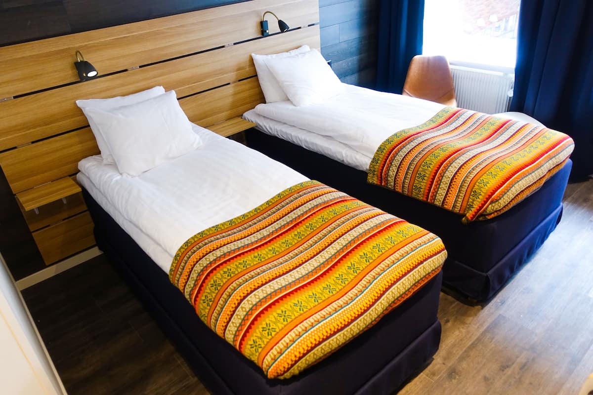 premium bedding, desk, blackout curtains, iron/ironing board