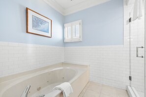 Bathtub, hair dryer, towels, soap