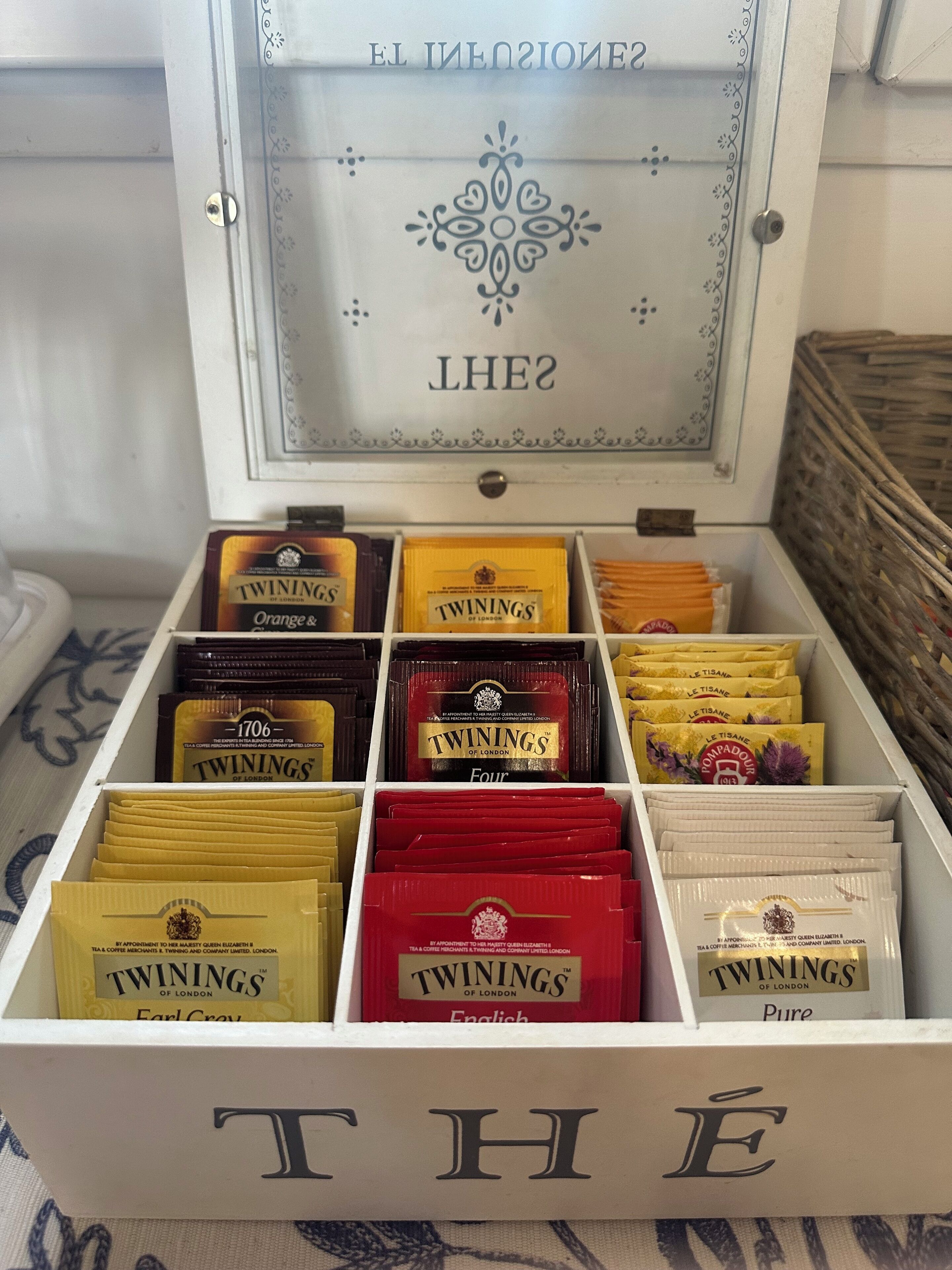 A box of Twinings tea with various flavors and types, including Earl Grey and English.