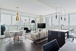 Deluxe Suite, 2 Queen Beds, City View, Executive Level | Living room | TV - Suite Digs The Guardian North (Calgary)