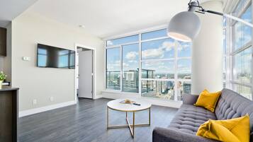 Premium Suite, 2 Queen Beds, City View, Tower | Living room | TV