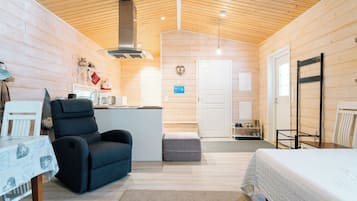 Villa | Living area | 50-inch flat-screen TV with cable channels, heated floors